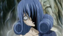 That would definitely be, without a doubt

JUVIA LOCKSER

Why? You ask. Well.....

She's just creepy, and stalkerish. She gets jealous way to easily. Like seriously, poor Lucy. Juvia needs to learn that Gray is either not interested in her, or is just dense about the situation. And it annoys the hell outta me on how whenever Lucy laughs or hangs with Gray she gets all defensive and jealous and is all, weird and bitchy about it. And frankly I don't think she's pretty, the girl needs to get a life. And therefore I don't understand why so many people like Juvia, I mean watch her closely, she's creepy. And this picture proves it.....