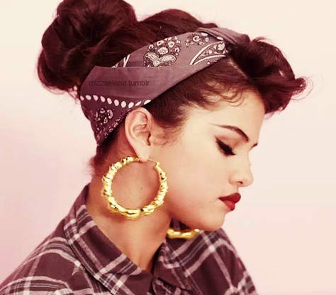 Selena with her eyes closed. 