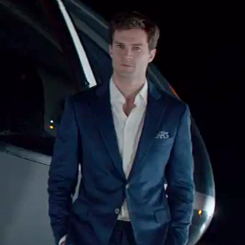  Jamie as Christian Grey in a dark blue suit<3