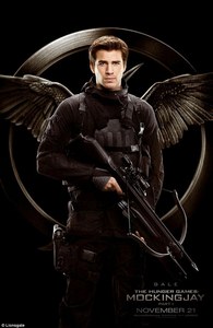  Liam holding a weapon on the Mockingjay HG teaser poster<3