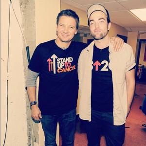  Jeremy Renner and Robert Pattinson wearing Stand Up To Cancer shirts<3