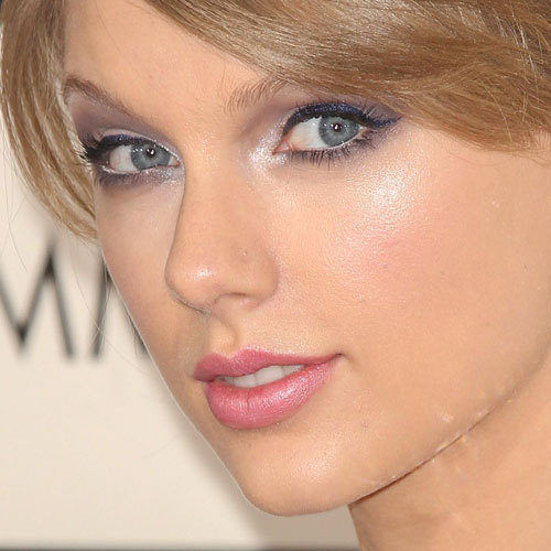 Taylor wearing pale pink lipstick,and in the link below with red lipstick 

http://audrey.buzznet.com/photos/eventaylorswiftslips/?id=68419157