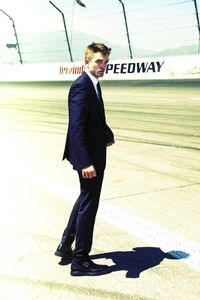 my sexy Brit standing on a racetrack...my heart races whenever I see him<3