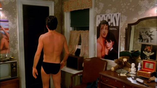  John with a Rocky, Farah Fawcett and other posters on his bacheca :)
