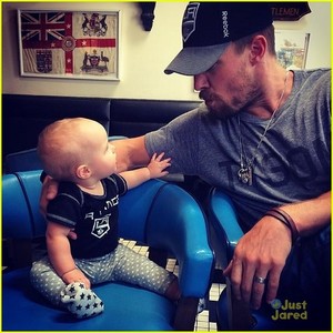  Stephen looking down at his adorable daughter<3