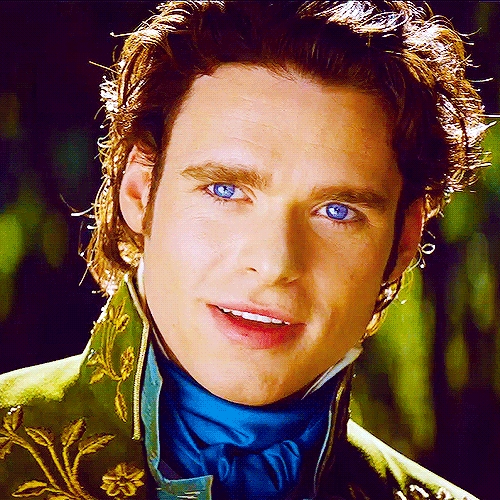 his blue eyes just pop out against his green tunic jacket<3