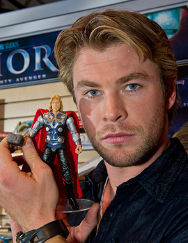  Chris holding a toy Thor figure<3
