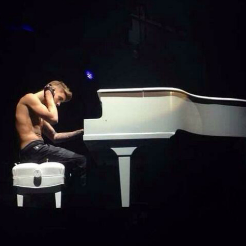  Justin playing the piano on his believe tour!