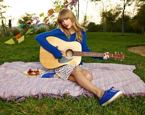 Here's Tay with a Guitar

https://tlgo.files.wordpress.com/2014/11/009.jpg

http://data.whicdn.com/images/3538475/large.png

http://images4.fanpop.com/image/photos/14800000/Teardrops-On-My-Guitar-FanMade-Single-Cover-taylor-swift-album-14870399-400-400.jpg

http://images4.fanpop.com/image/photos/20400000/Teardrops-On-My-Guitar-FanMade-Single-Cover-taylor-swift-20403383-600-600.jpg

http://s9.favim.com/orig/130918/guitar-photoshoot-state-of-grace-taylor-swift-Favim.com-931913.jpg
