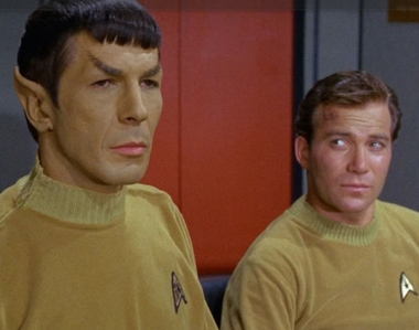  If Kirk was born in 2233 and became captain of the USS Enterprise in 2265 (first episode of the Original Series "Where No Man Has Ever Gone Before" (or a bit later)) and Spock was born in 2230, we can assume that Spock was about 35 years old at the very beginning of the original series.