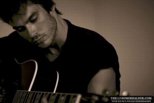  Ian with a gitar <3