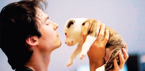  Ian from the side cuddling with a cute puppy<3