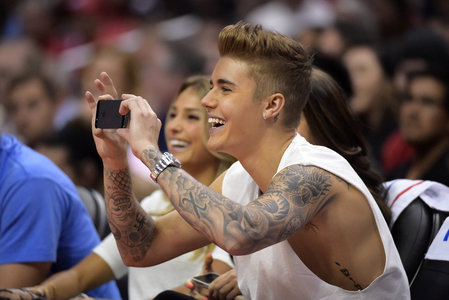  Justin taking a pic on his cell phone