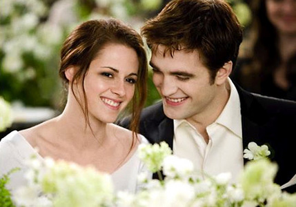  this pic of my babe and Kristen,from a scene in Breaking Dawn in which their characters just got married.A marriage is a perfect example of happiness<3