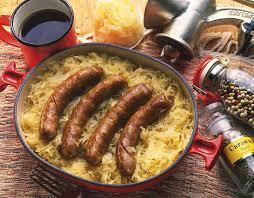  Die Wurst یا German sausage. In this تصویر taken with sauerkraut, coffee, and some spices.