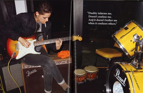 Kristen playing guitar