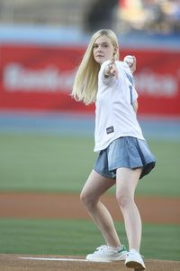  Elle throwing a baseball.