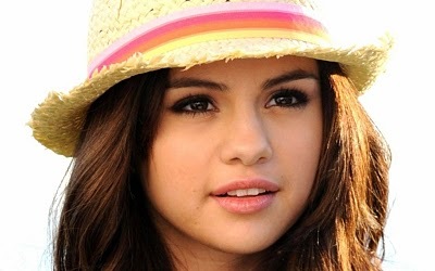 Post a picture of Selena Gomez with straight hair and hat or a head band . Something like what i have posted 