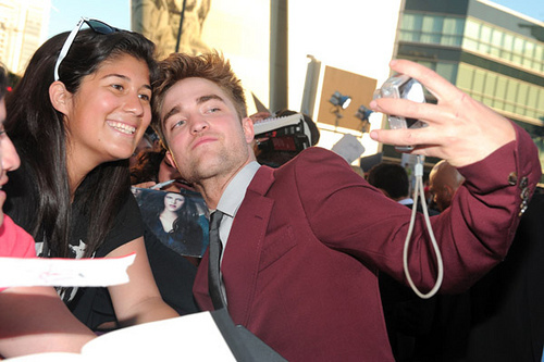  Post a pic of your actor holding a camera and taking a pic of himself with a fan.Here's my Robert at the Eclipse premiere taking a pic of him with a fan...lucky girl:)