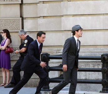  Post a picture of an actor with someone walking behind him :)