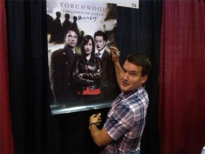  Post a picture of an actor with a poster.