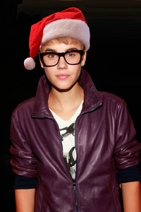  Post a picture of an actor with a fake santa hat.