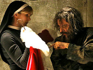  THE DEVIL'S LITTLE HELPER Sister Mary helps Jean Valjean -- er, I mean Monsieur Lee Miserables get suited up for a Briarcliff slay ride in "Unholy Night"