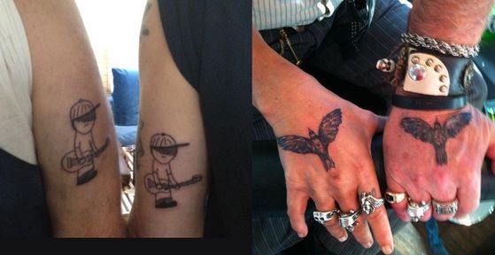 Bill and Johnny with their "Little Guitarist" and "Crow" tattoos.