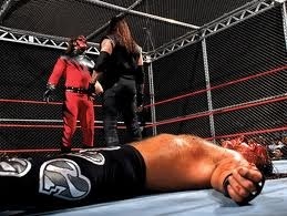  kanes debut first ever hell in a cell match kane tombstones taker and shawn escapes