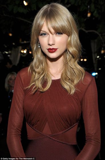  Flawless: She wore her ash-blonde hair in soft waves around her face and added a slick of glossy red lipstick