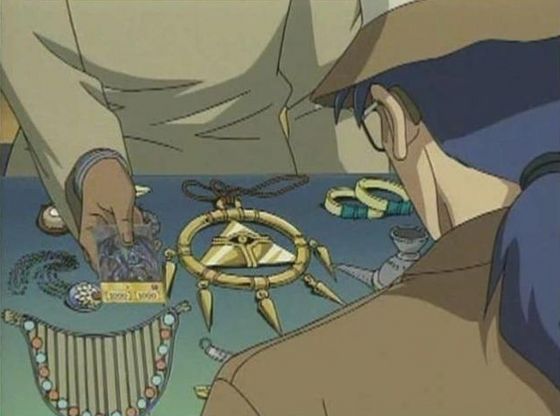 Bakura's father looking at the Millennium Ring and other items!