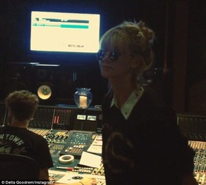  Dancing in the studio: Delta can't help herself and dances away to one of her songs as it is recorded