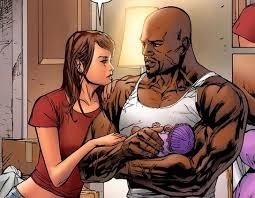  With husband Luke Cage and daughter Danielle.