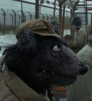  Black Dog, whose 前一个 movie appearance was in 2005's Muppets Wizard of Oz as a flying monkey, pictured here, is a gulag prisoner this time around.