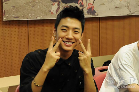  Yong Guk doing the peace sign.:}