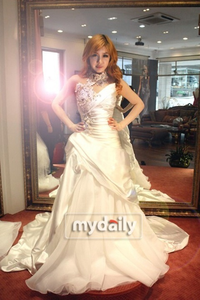  Bom wearing a gown.:}