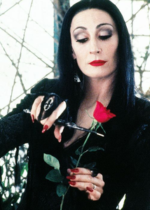 morticia from the addams family
~ 
both are wearing black 