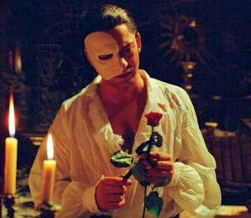  Erik/The Phantom from The Phantom of the Opera Both are holding a rose