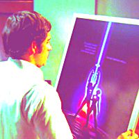  7. Pop Culture Reference (Chuck's Tron Poster)