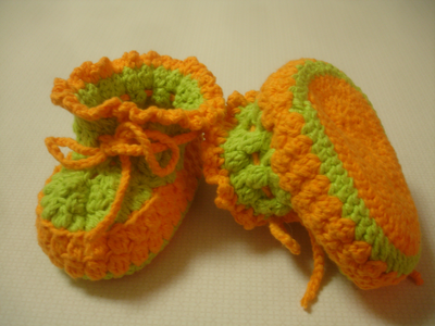  These sweet little booties are knitted with cotton yarn (100% cotton) They are a 6 to 12 months size,