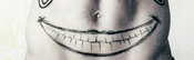  [b]14. Favourite tattoo ? [/b] pag-ibig all the Joker's tattoos, but I really like the big smile.