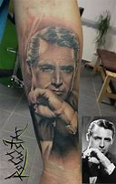  hari 8 - With a Tattoo.I couldn't find Cary with a Tattoo but I found a Tattoo of Cary ! I want this