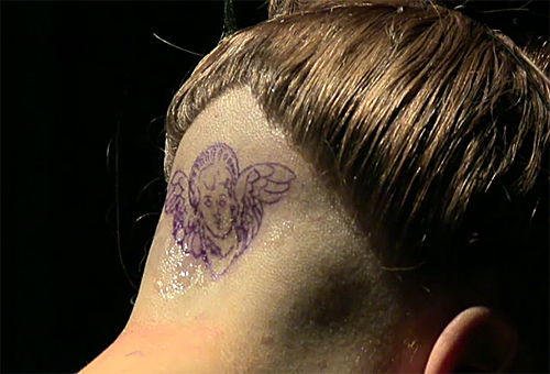  GAGA GETTING A TATTOO ON HER HEAD AT FAME LAUNCH
