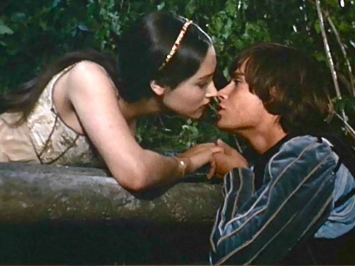 Romeo & Juliet about to kiss on Balcony.
