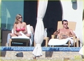 Jennifer and Justin sunbathing in Los Cabos, Mexico (28.12.2012)  - jennifer-aniston photo