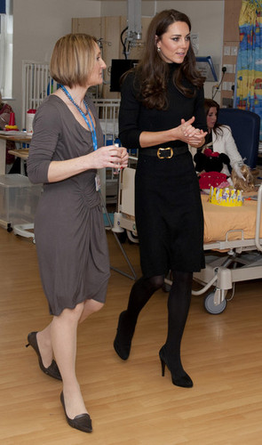 talks to patient Carson Hartley as she visits Alder Hey Children's Hospital