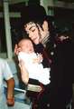 michael and a baby - michael-jackson photo