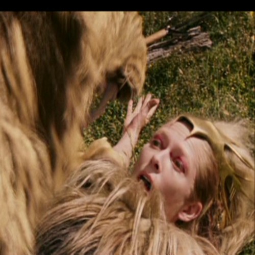 Jadis on the ground and tries to reach her sword.