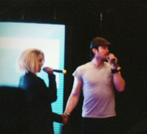  Kat and Ian holding hands at the convention in Paris
