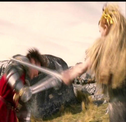  Jadis hits Peter on the arm with her Sword.